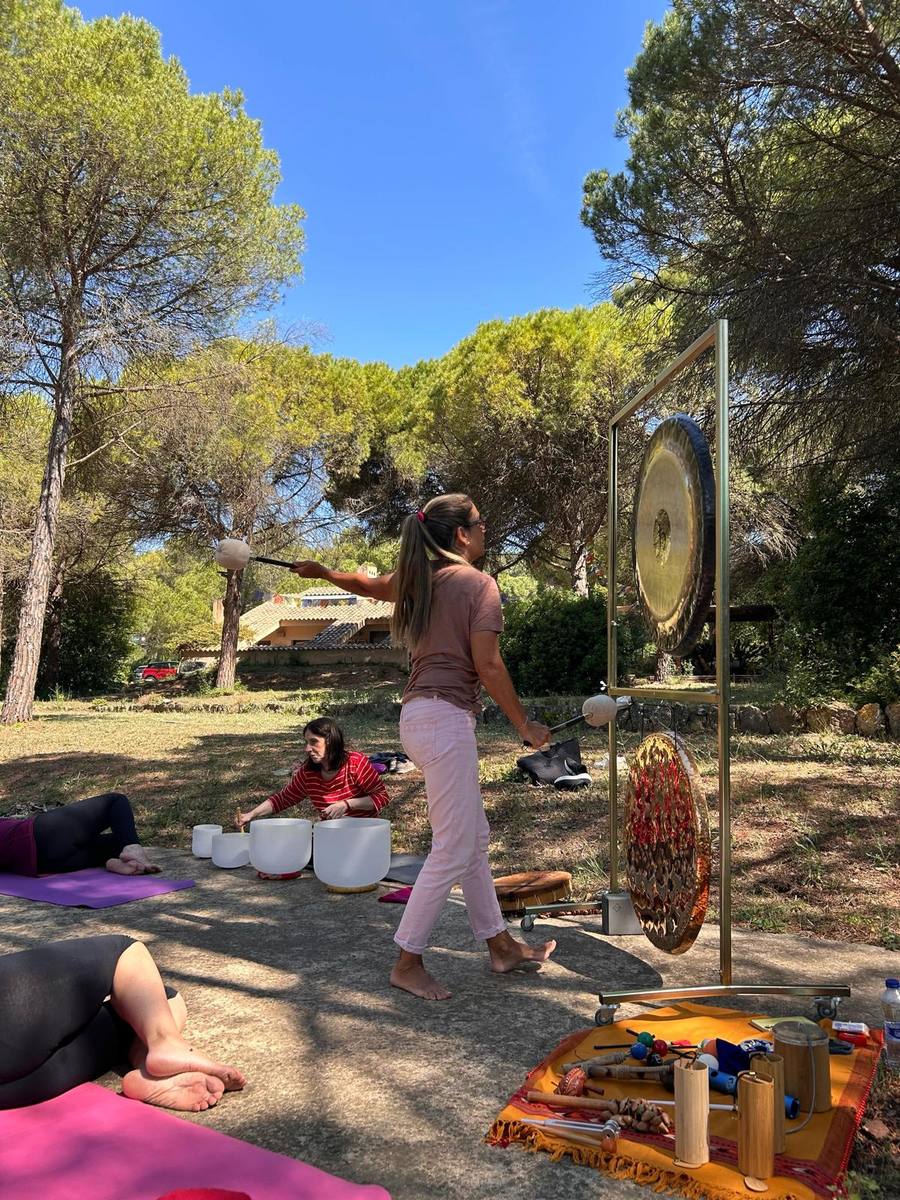 Montse with gong and crystal bowls during forest session
