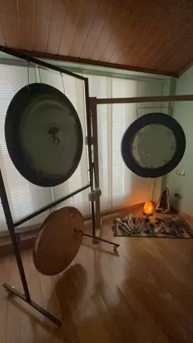Two planetary gongs including the Saturn gong and a shamanic drum in the room